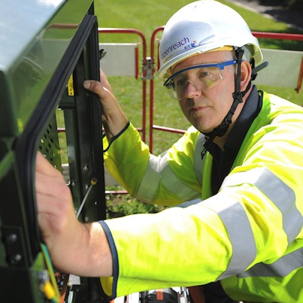 engineer openreach working on fttc street cabinet