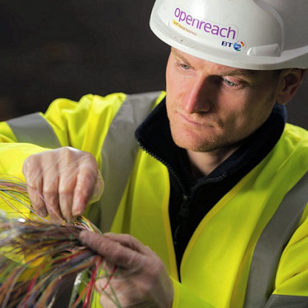 engineer touching broadband cables openreach bt