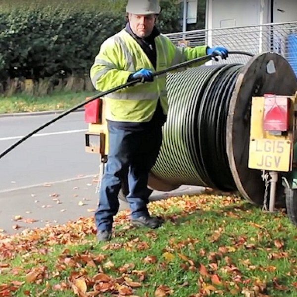 openreach engineer with drum of fibre optic cable