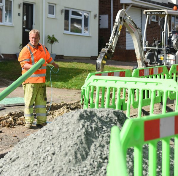 county broadband engineer holding fibre duct ftth
