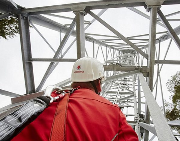 Vodafone mobile wireless mast and engineer