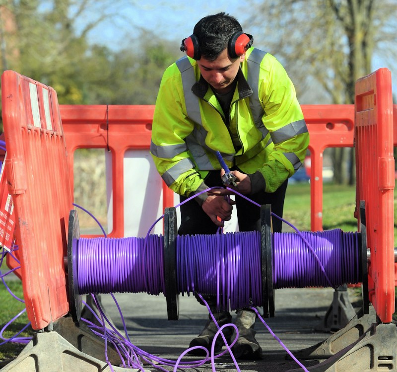 cityfibre engineer over reel of purple fibre