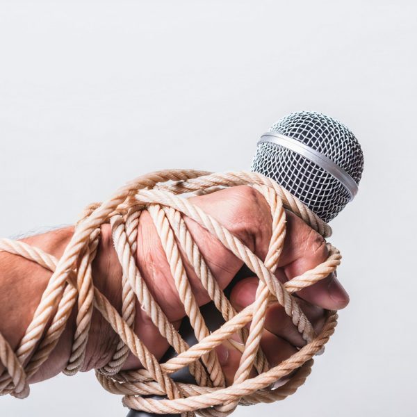 Censorship image of hands bound by rope