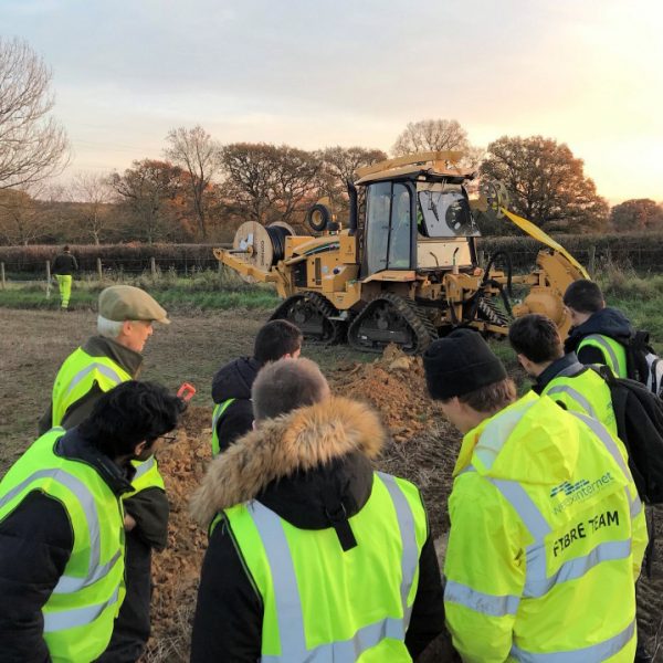 wessex internet fibre team in field tractor