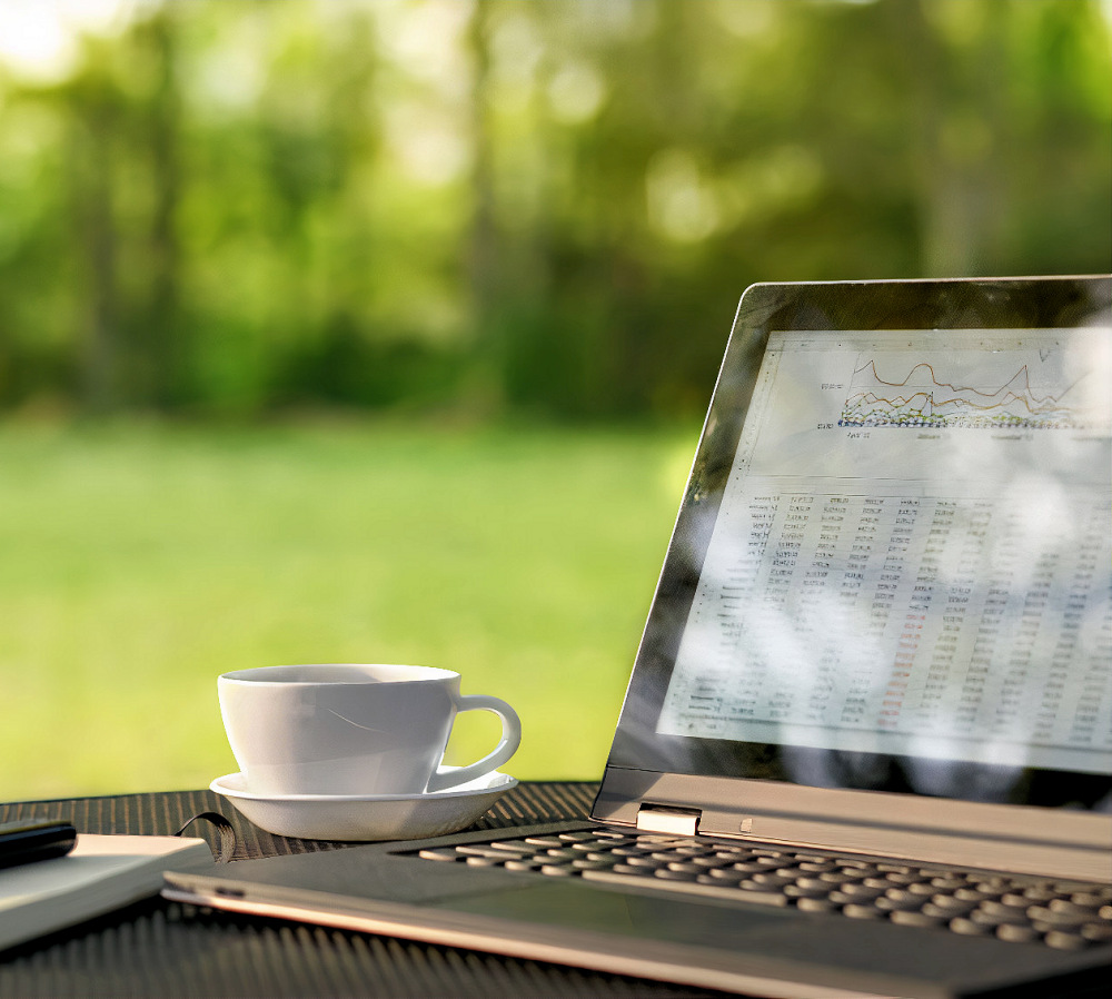 Laptop and coffee in outdoor office