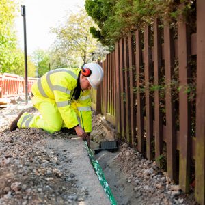 virgin media o2 engineer at work over trench 2021