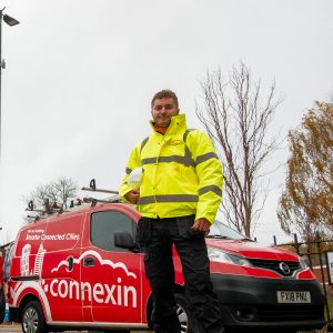 Connexin Engineer Next to Van