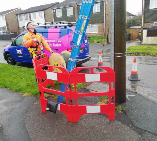 Brsk engineer next to telegraph pole