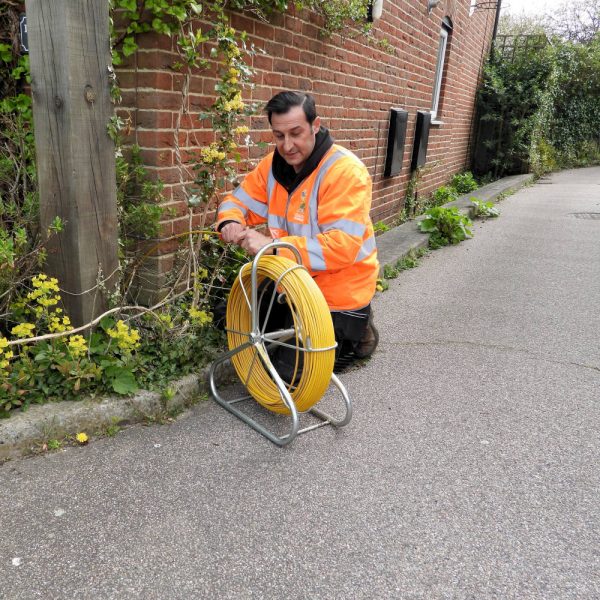 County-Broadband-Engineer-Next-to-Fibre-Spool
