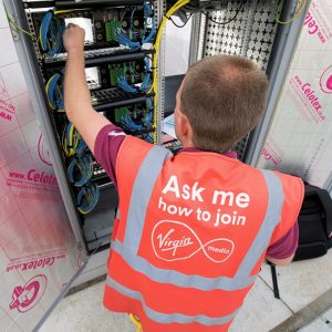 virgin media engineer poking cabinet
