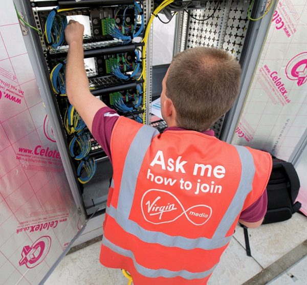 virgin media engineer poking cabinet