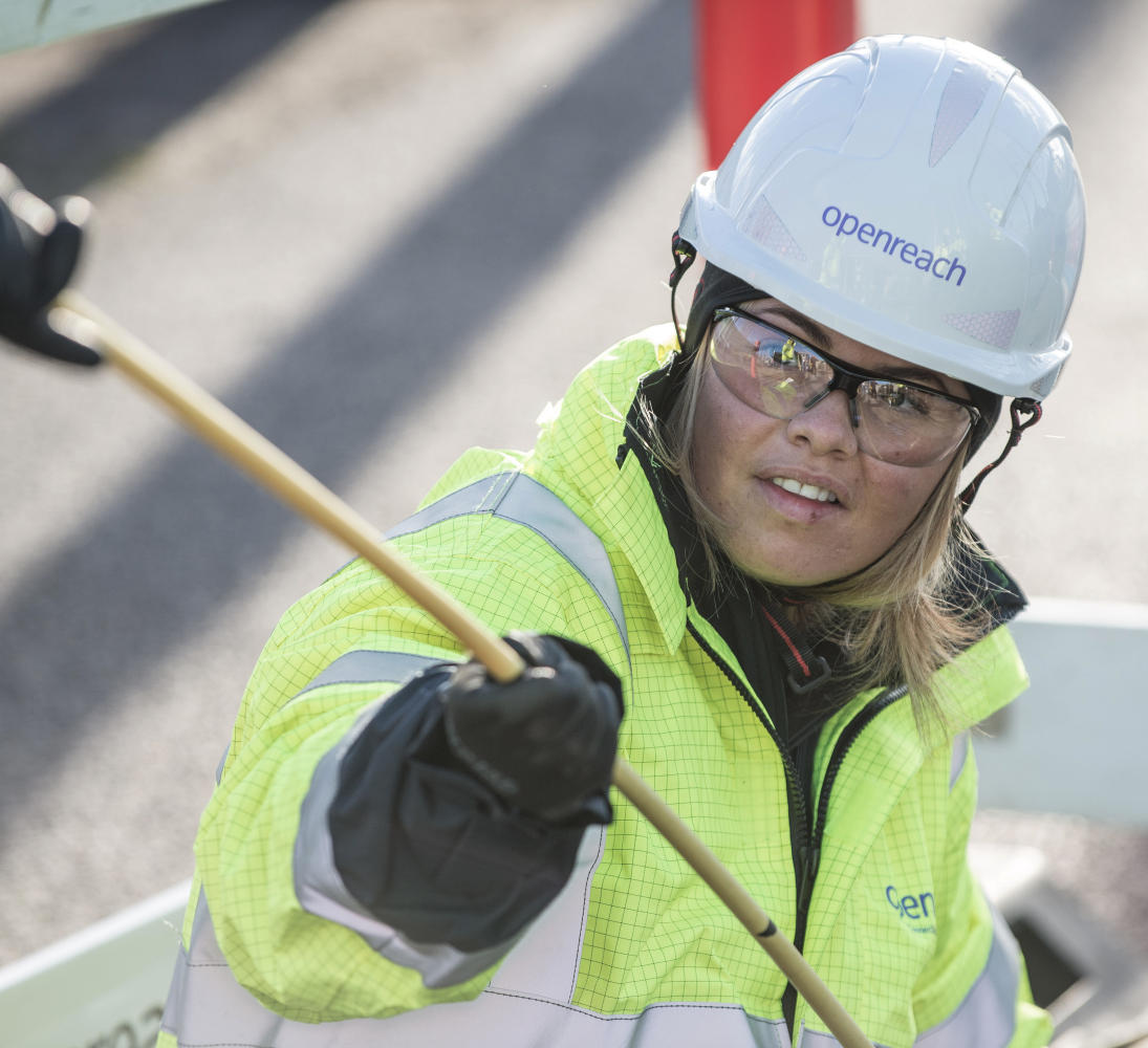 Female Engineer Pulling Fibre Cable
