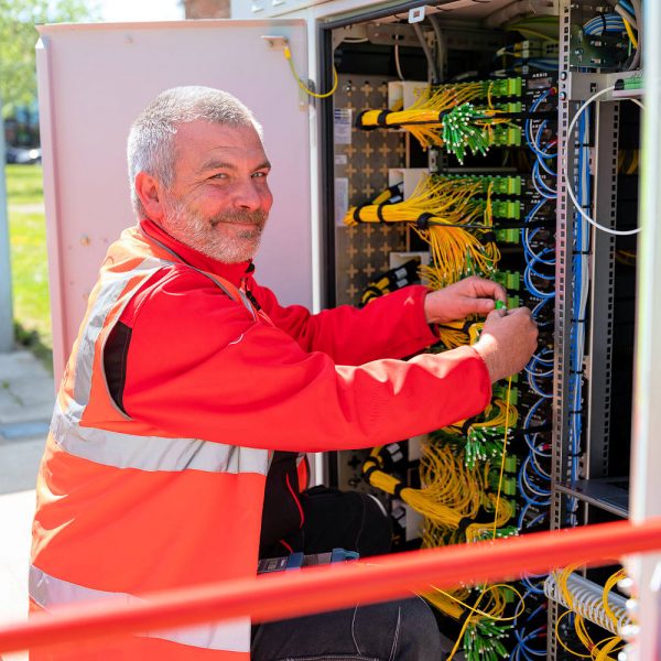 Virgin Media O2 Engineer Working Inside FTTP Cabinet