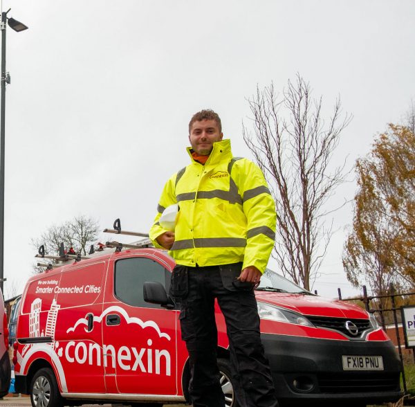 Connexin Engineer Next to Van