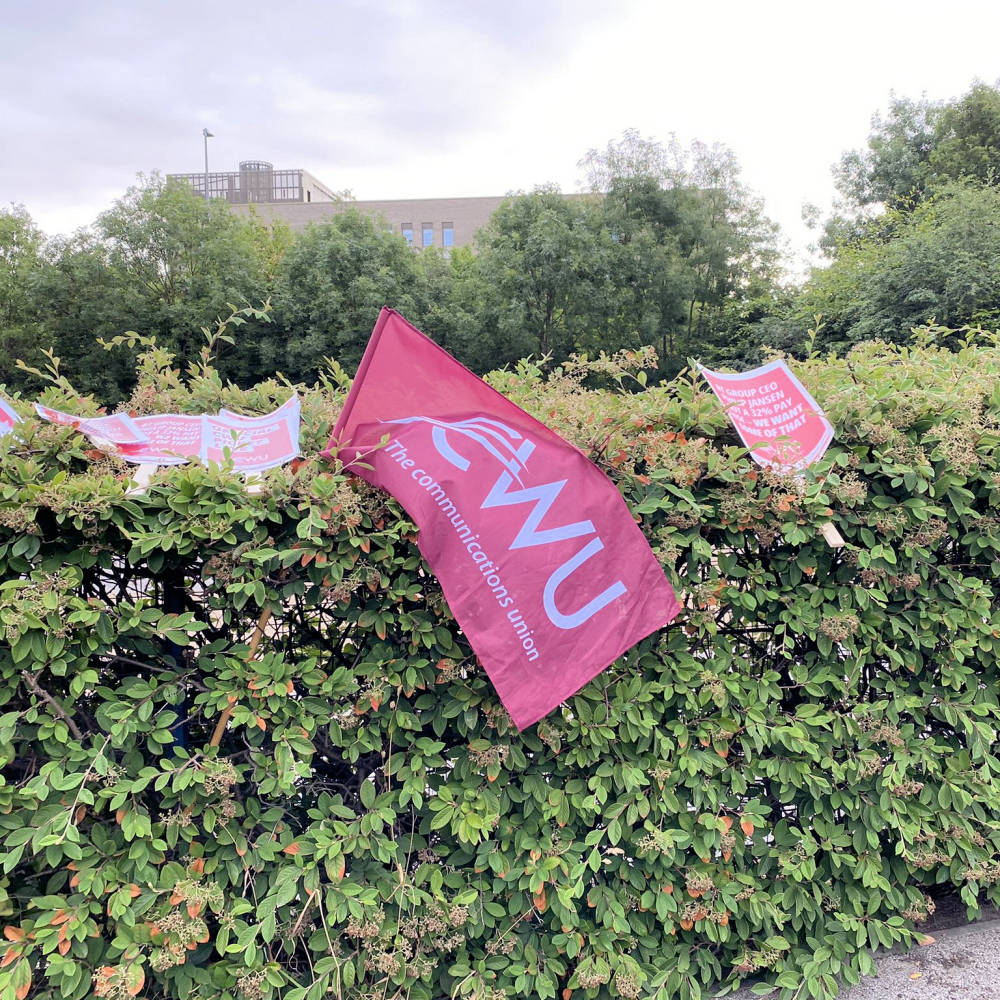 CWU-Banners-Draped-Over-a-Bush-in-UK