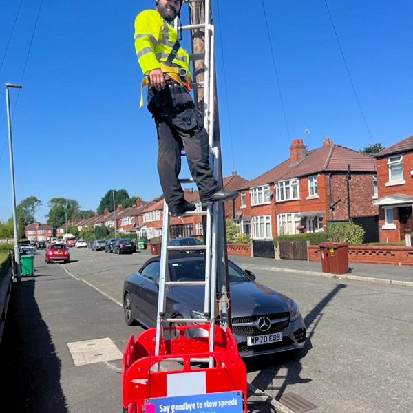 Brsk Engineer up Ladder on Pole
