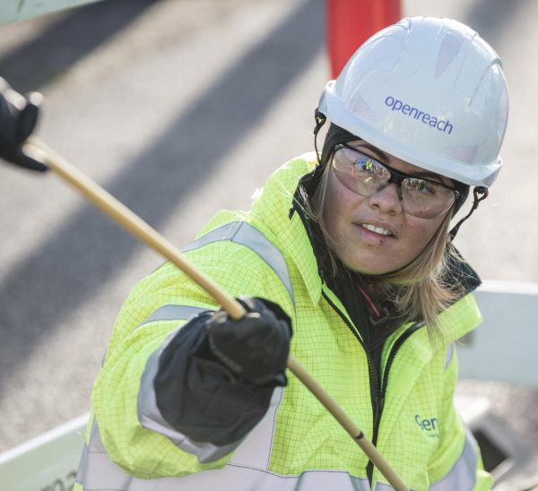 Female Engineer Pulling Fibre Cable