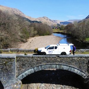 BT-Engineer-Next-to-Van-and-Bridge-Over-River-2023