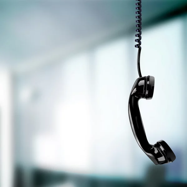 Phone handset hanging from cord - 123RF - 26684886.webp