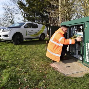 County-Broadband-Engineer-Working-on-Street-Cabinet