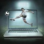 Football player kicking ball over uk internet laptop screen