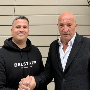 Mike Walsh and Nigel Barnett of TAL Group shaking hands