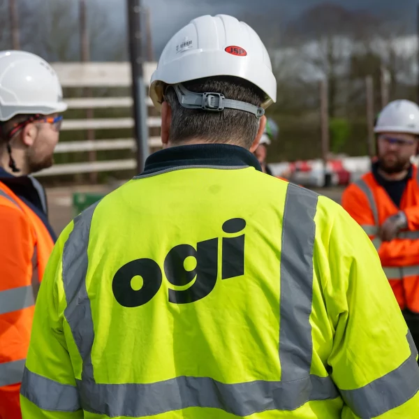 Ogi-written-on-back-of-broadband-engineer-jacket-uk