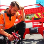 Lightning-Fibre-engineer-leaning-over-tool