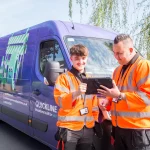 Quickline-engineers-looking-at-tablet