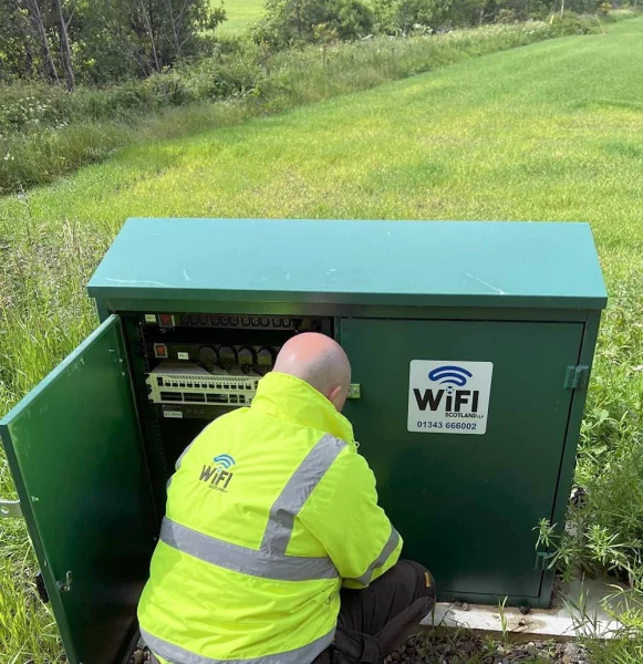 WiFi Scotland Engineer Working on Broadband Cabinet