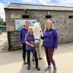 Stable Life Manager Mags Powell with employees - GoFibre Fund