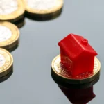 House on top of one uk pound of money by 123rf ID115586217