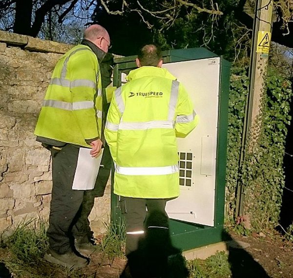 truespeed engineers looking at cabinet