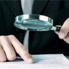 Contract under magnifying glass