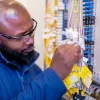 Openreach exchange engineer testing fibre