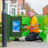 CityFibre-UK-2024-Engineer-Kneeling-in-front-of-Cabinet